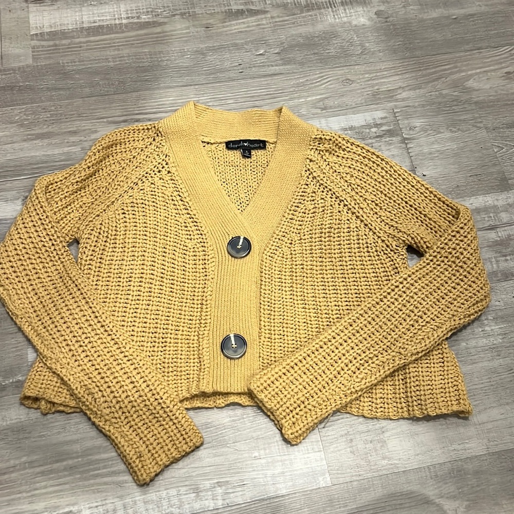 Small yellow derekheart sweater.